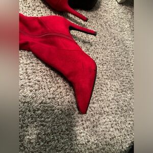 Red over the knee (mid knee) heels.